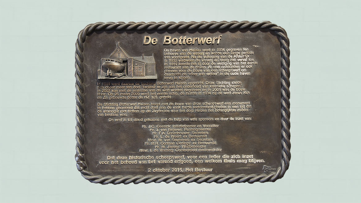 Bronzen tekstplaquette met beeldelement